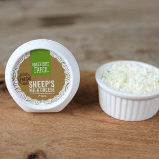 Green Dirt Farms sheep's milk cheese on wooden board